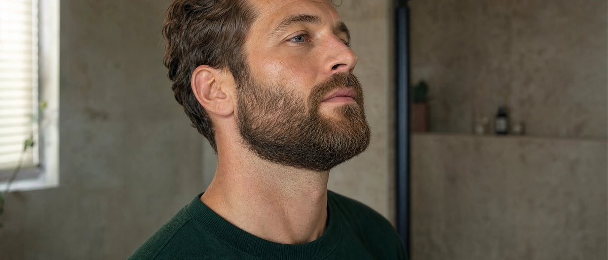 Side view of a neatly shaped beard and natural neckline